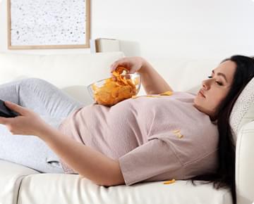 Sitting on the Couch Eating Chips.